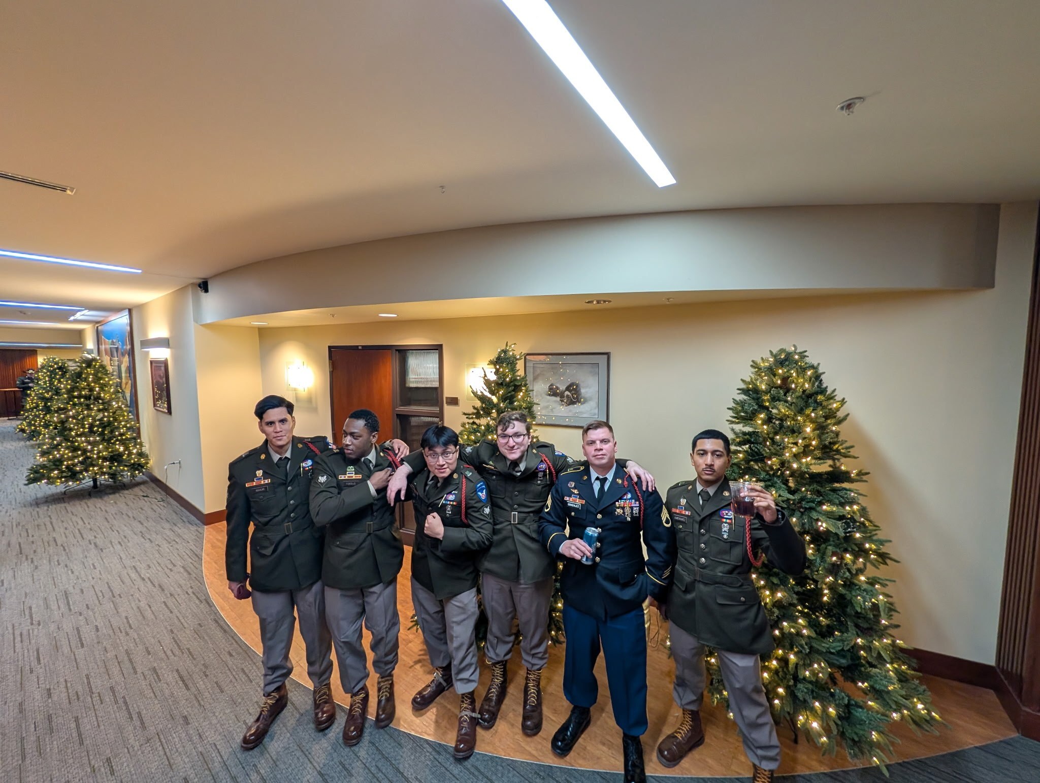 Staff Sgt. Joel Gonzalez in dress uniform with fellow soldiers